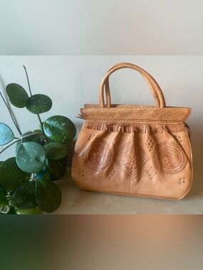 Genuine leather structured handbag with embossed print